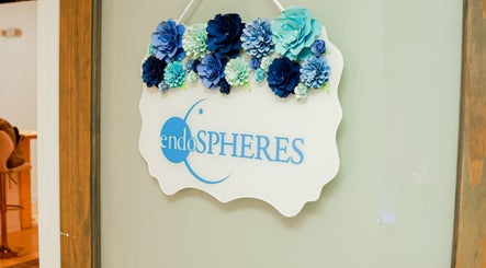Decorative sign with blue flowers at SkinSation Endospheres Wellness & Massage, Mount Pleasant, South Carolina, US.
