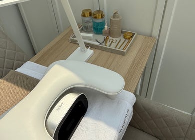 Manicure station at The NAIL ENVY Bar in Cardiff, Wales, GB with tools and UV lamp.