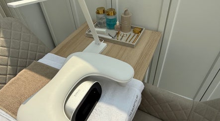 Manicure station at The NAIL ENVY Bar in Cardiff, Wales, GB with tools and UV lamp.