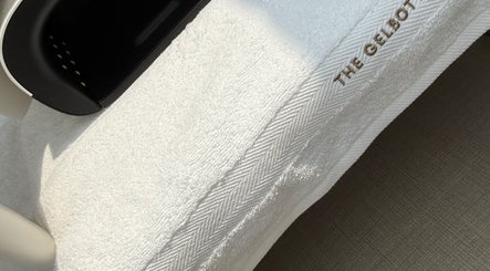 A sleek nail dryer on a soft towel at The NAIL ENVY Bar, Cardiff, Wales, GB showcasing luxury and comfort.
