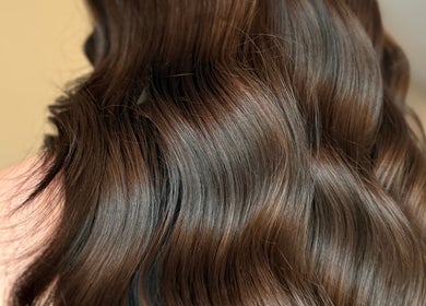 Luxurious brown wavy hair styled at Studio B – Bruce Johnstone Hairdressing, Dundee, Scotland, GB.