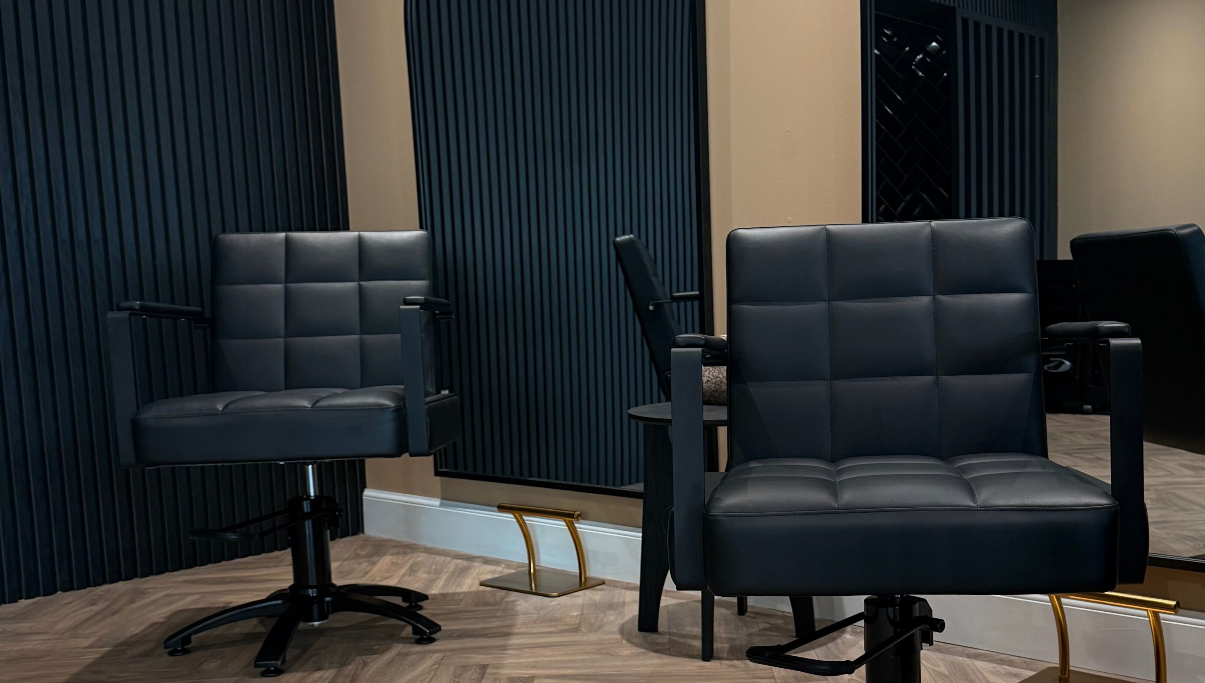 Modern salon chairs at Studio B – Bruce Johnstone Hairdressing in Dundee, Scotland, GB.