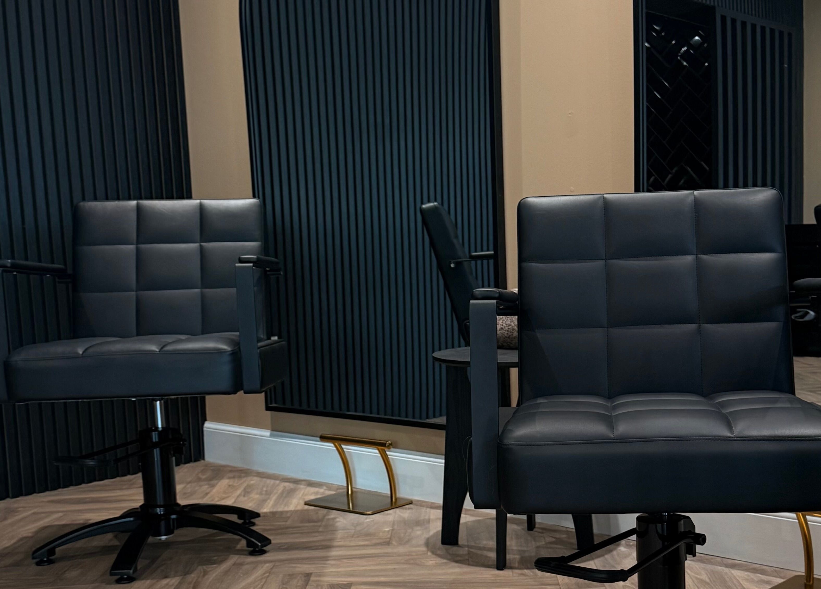 Modern salon chairs at Studio B – Bruce Johnstone Hairdressing in Dundee, Scotland, GB.