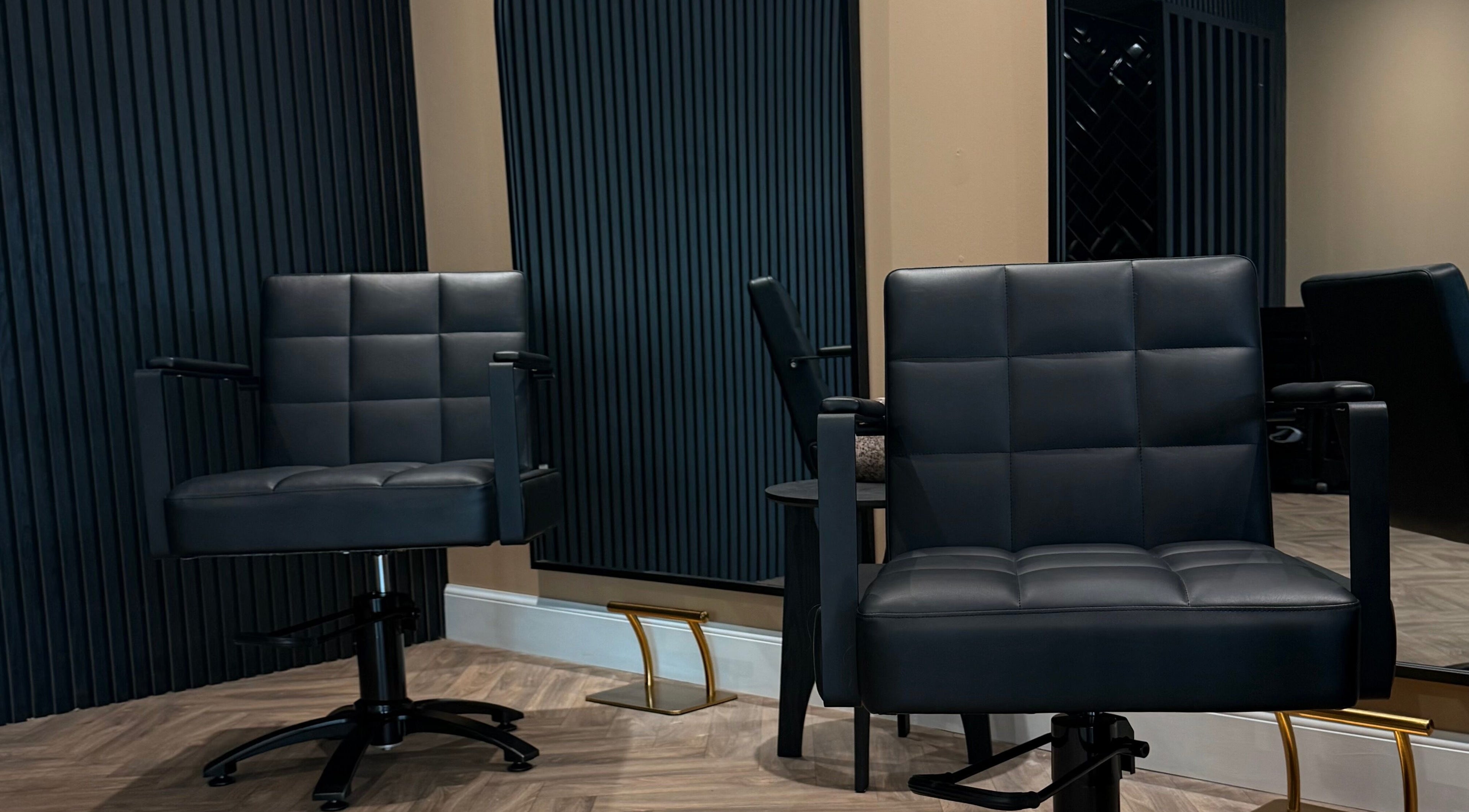 Modern salon chairs at Studio B – Bruce Johnstone Hairdressing in Dundee, Scotland, GB.