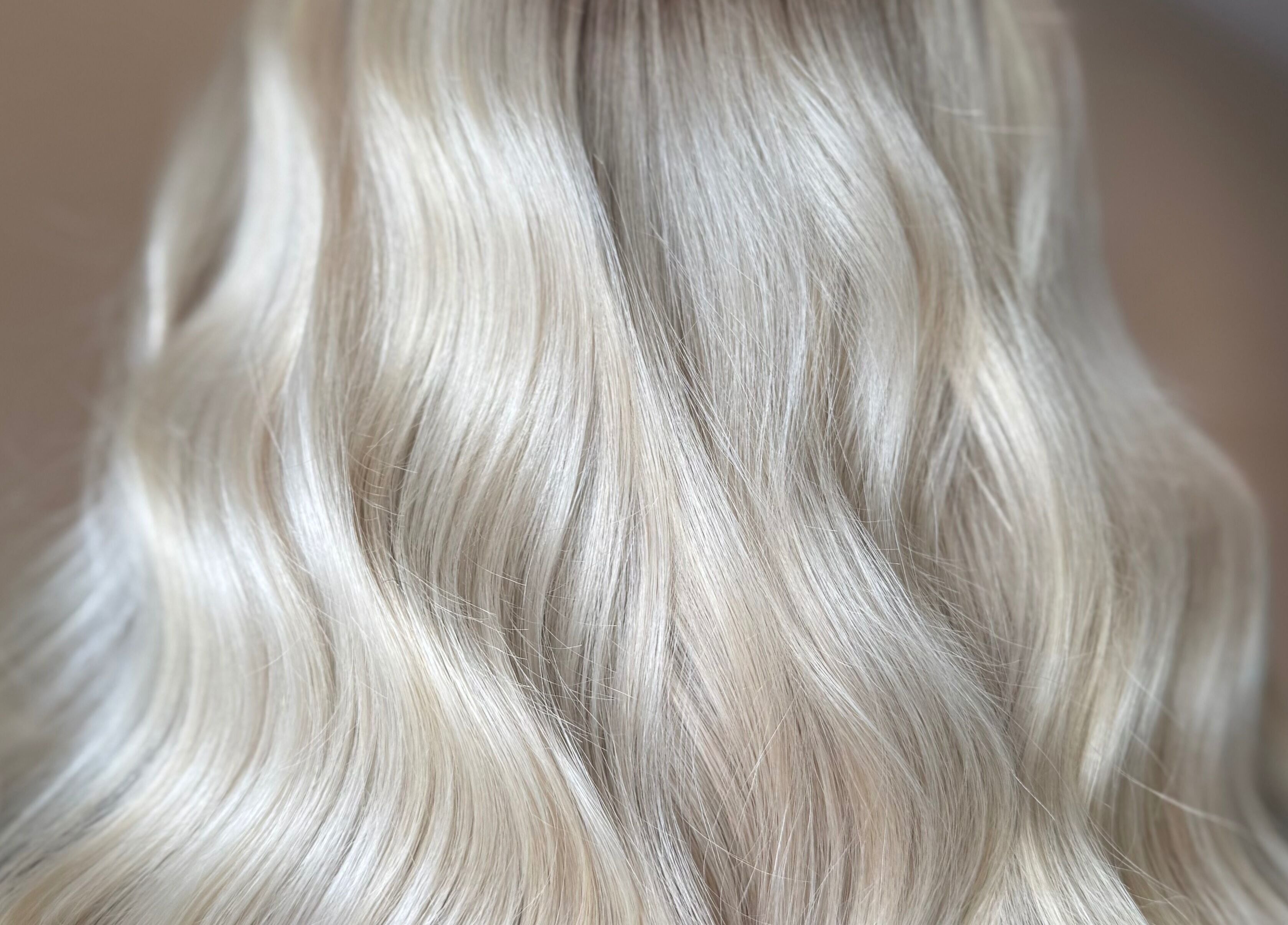 Silky blonde hair styled in waves at Studio B – Bruce Johnstone Hairdressing, Dundee, Scotland, GB.