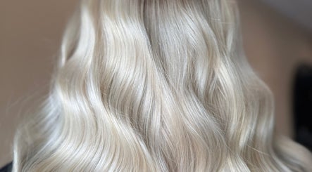 Silky blonde hair styled in waves at Studio B – Bruce Johnstone Hairdressing, Dundee, Scotland, GB.