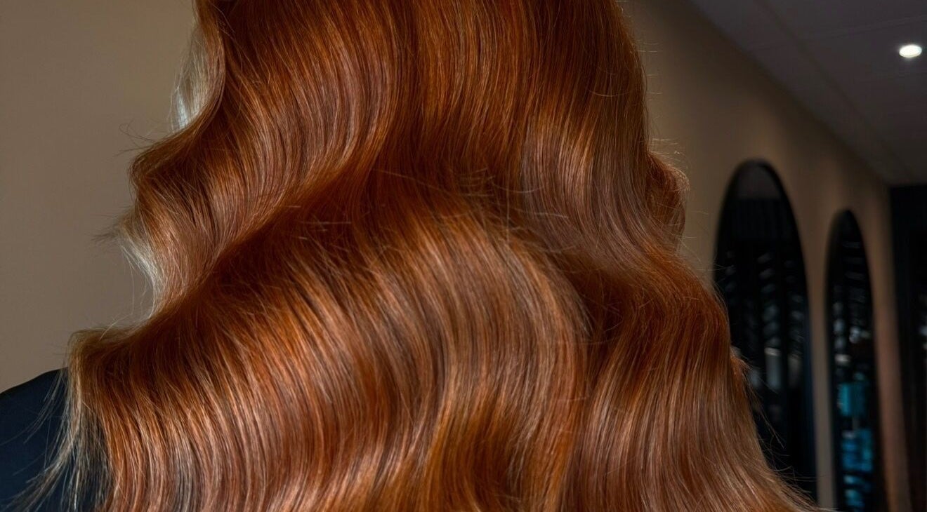 Vibrant copper hair waves styled at Studio B – Bruce Johnstone Hairdressing, Dundee, Scotland, GB.