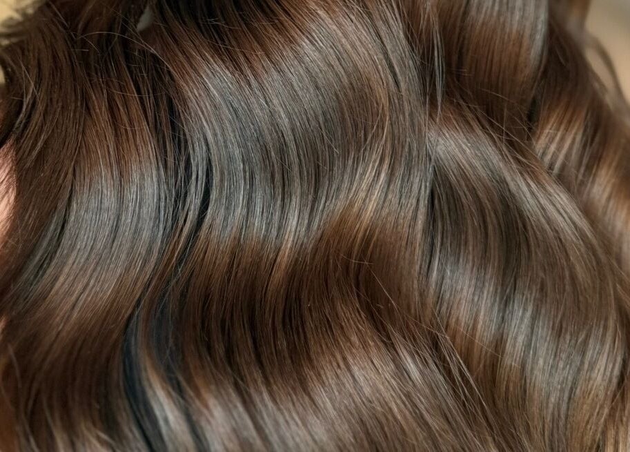 Close-up of luxurious, wavy hair at Studio B – Bruce Johnstone Hairdressing, Dundee, Scotland, GB.