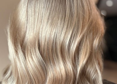 Close-up of wavy blonde hair styled at Studio B – Bruce Johnstone Hairdressing, Dundee, Scotland, GB.