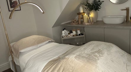 Cozy treatment room at Skin Space by Lauren in Worsley, England, GB with soft lighting and spa essentials.