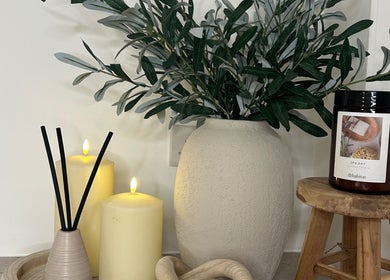 Calming decor at Skin Space by Lauren in Worsley, England, GB with candles and greenery.