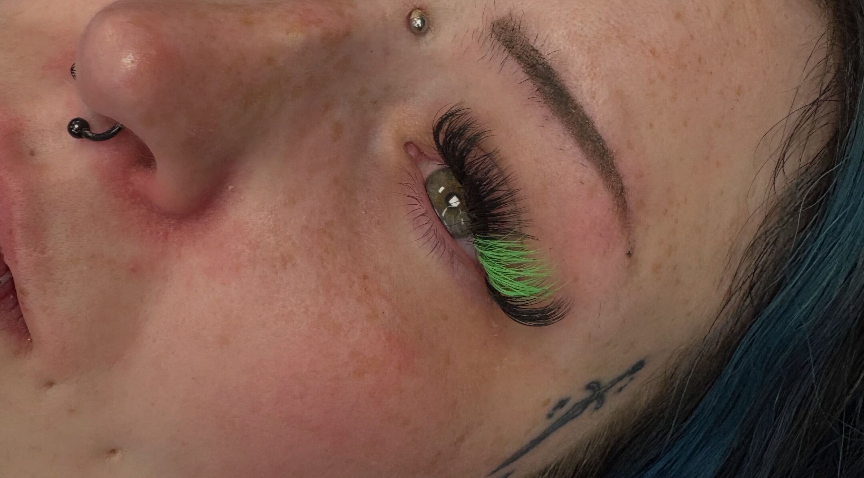 Colorful eyelash extensions at Lashesbyjazminexo in Parkgate, England, GB showcasing intricate detail.