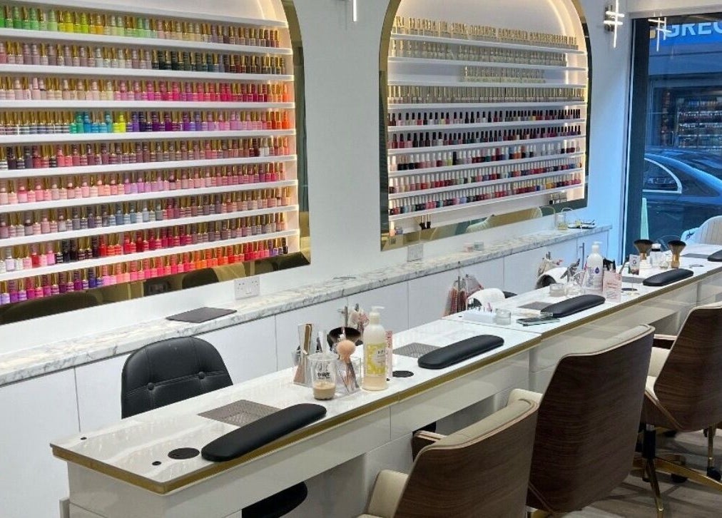 Nail polish display at Belle Ame Beauty Champagne Lounge, London, England, GB offers a serene pampering experience.