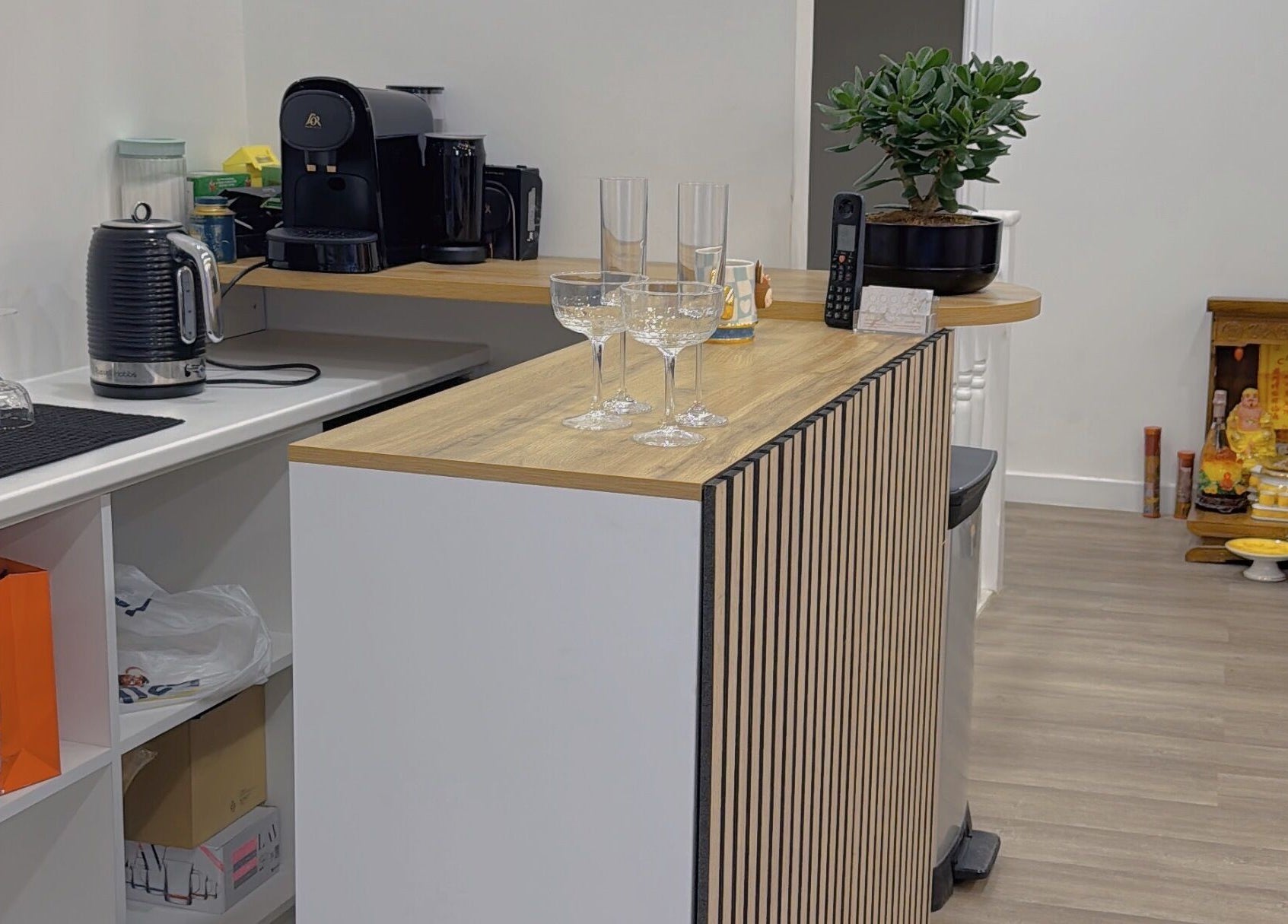 Elegant counter at Belle Ame Beauty Champagne Lounge, London, England, GB, set with glassware and a coffee machine.