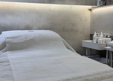 Relaxing treatment room at SkinCure, Castleford, England, GB with a comfortable spa bed and skincare products.
