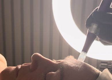 Facial treatment at SkinCure, Castleford, England, GB under soft halo lighting.