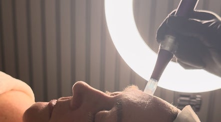 Facial treatment at SkinCure, Castleford, England, GB under soft halo lighting.