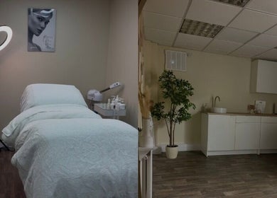 Calm treatment room at SkinCure, Featherstone, England, GB, featuring a cozy bed and ambient lighting.