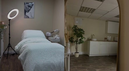 Calm treatment room at SkinCure, Featherstone, England, GB, featuring a cozy bed and ambient lighting.