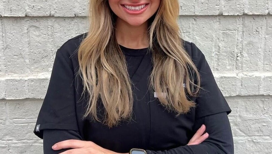 Friendly staff member at The Daily Glow LLC in Tuscaloosa, Alabama, US.