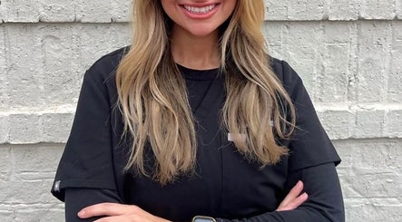 Friendly staff member at The Daily Glow LLC in Tuscaloosa, Alabama, US.