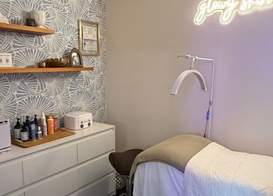 Cozy treatment room at The Daily Glow LLC in Tuscaloosa, Alabama, US, featuring modern decor and wellness equipment.