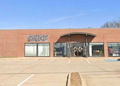 Front view of The Daily Glow LLC, Tuscaloosa, Alabama, featuring a stylish brick exterior.