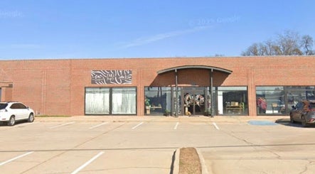 Front view of The Daily Glow LLC, Tuscaloosa, Alabama, featuring a stylish brick exterior.