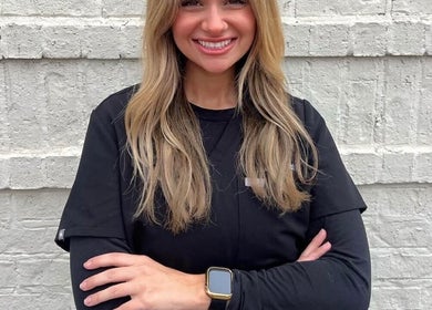 Smiling staff member of The Daily Glow LLC in Tuscaloosa, Alabama, US, showcasing a friendly and professional vibe.