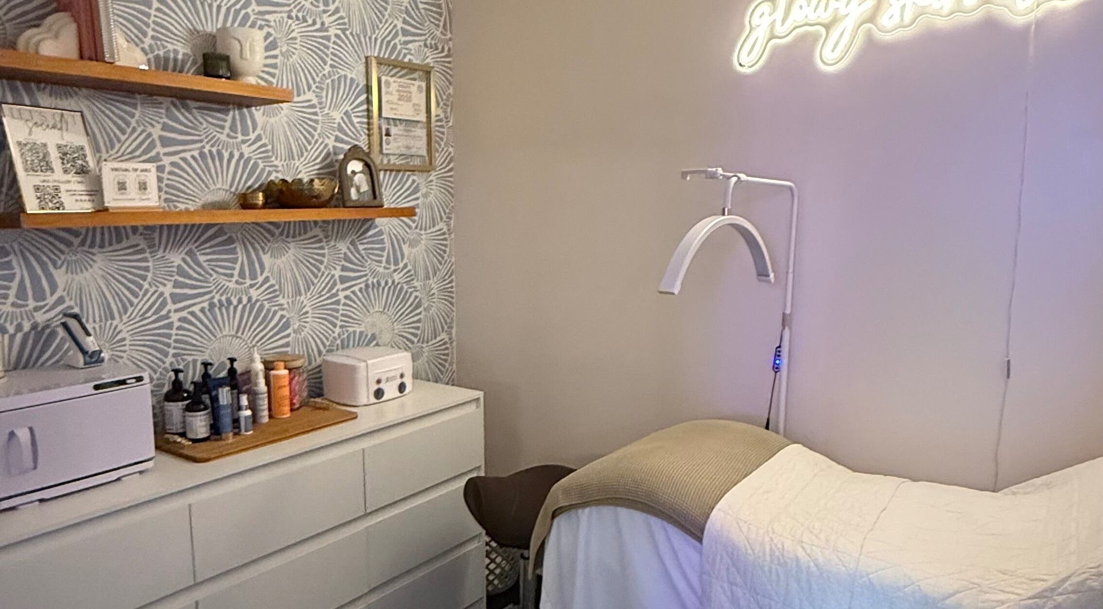Relaxing treatment room at The Daily Glow LLC, Tuscaloosa, Alabama, US with products and decor.