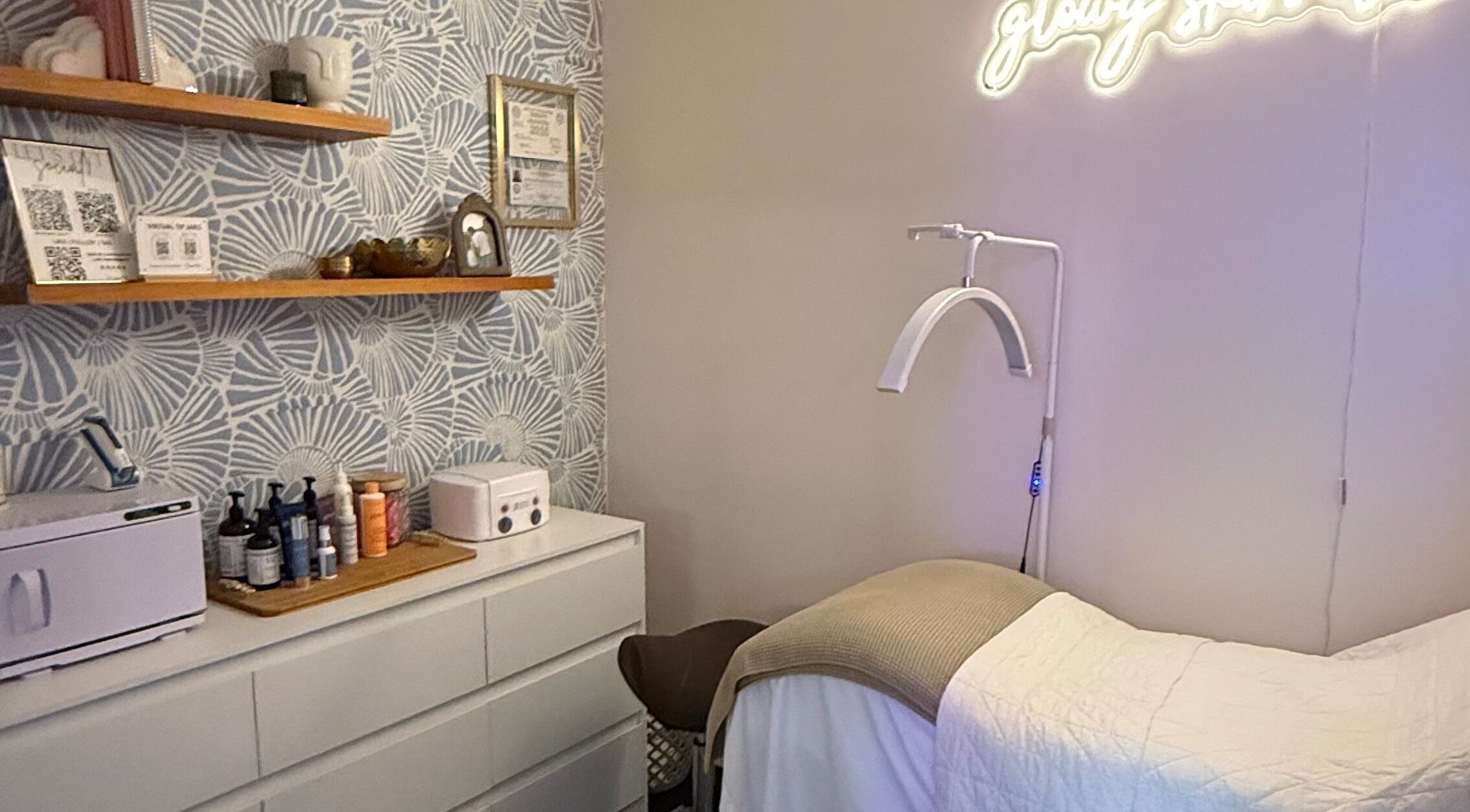 Relaxing treatment room at The Daily Glow LLC, Tuscaloosa, Alabama, US with products and decor.