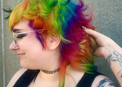Vibrant rainbow hairstyle created at Rainbows By Mariana, Rockford, Illinois, US showcases bold colorful flair.