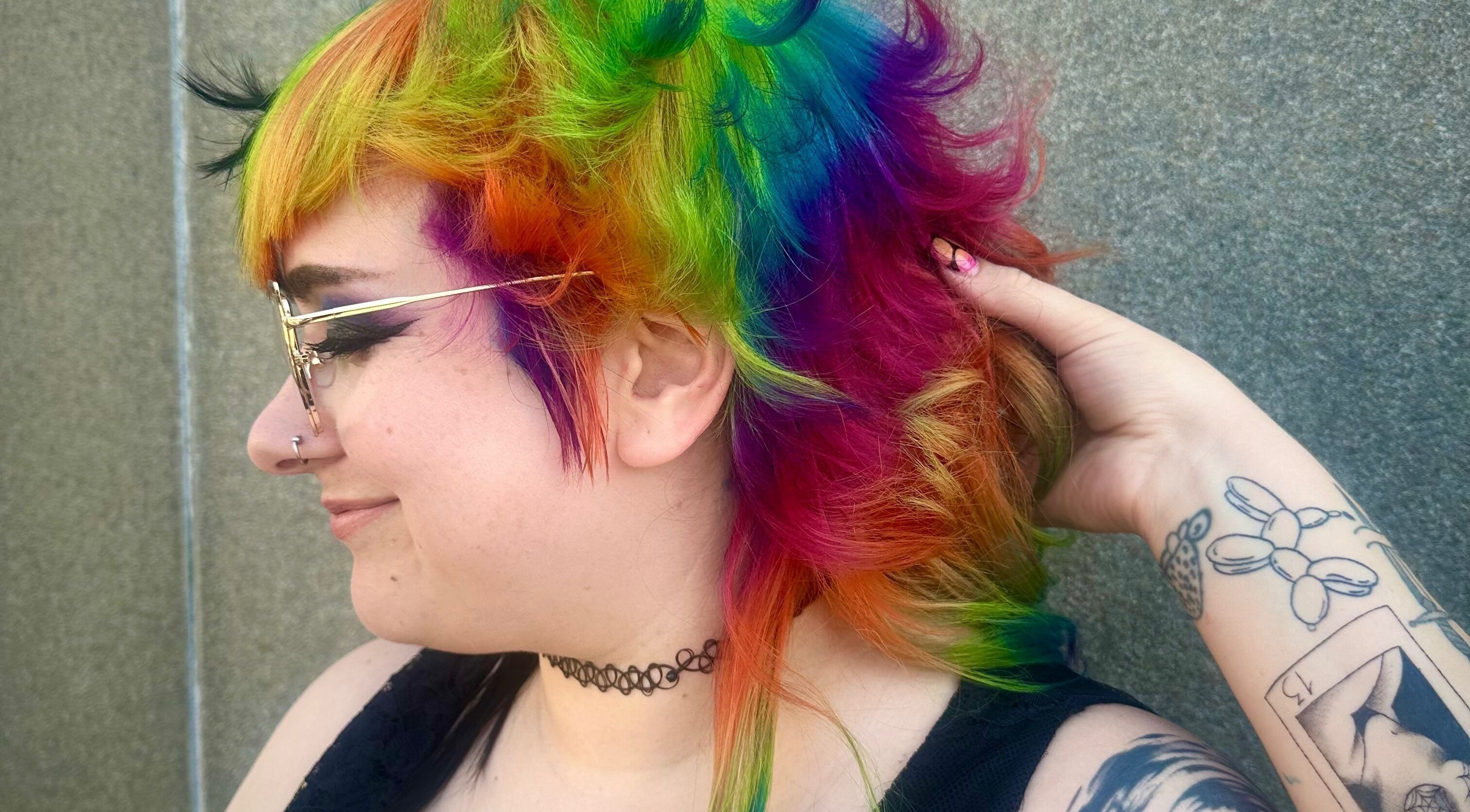 Vibrant rainbow hairstyle created at Rainbows By Mariana, Rockford, Illinois, US showcases bold colorful flair.
