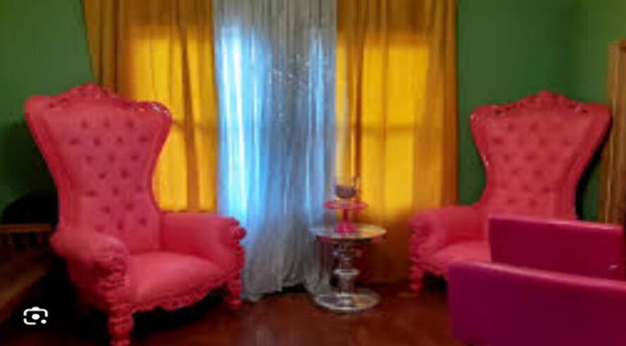 Luxurious pink chairs at Kbstyles, Jonesboro, Georgia, US enhance a vibrant, inviting ambiance.