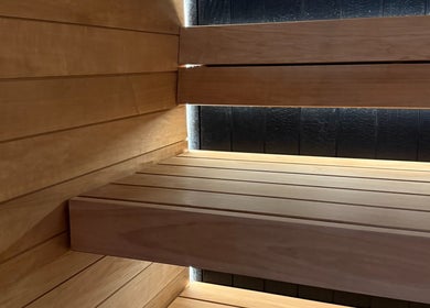 Cozy wooden sauna at Recovery Hive, Coolum Beach, Queensland, AU, offering a tranquil relaxation experience.