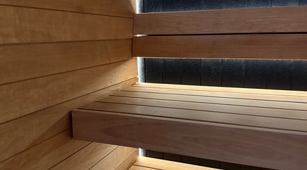 Cozy wooden sauna at Recovery Hive, Coolum Beach, Queensland, AU, offering a tranquil relaxation experience.