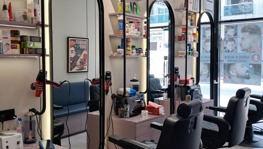 Modern interior of Sadeeq Al Shabab Gents Saloon, Dubai, Dubai, AE with mirrors and styling stations.