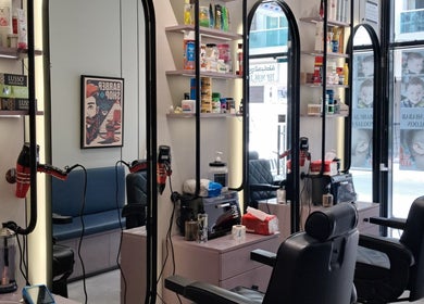 Modern interior of Sadeeq Al Shabab Gents Saloon, Dubai, Dubai, AE with mirrors and styling stations.