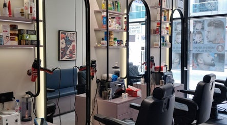 Modern interior of Sadeeq Al Shabab Gents Saloon, Dubai, Dubai, AE with mirrors and styling stations.
