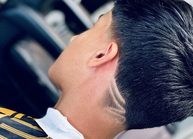 Stylish haircut at Sadeeq Al Shabab Gents Saloon, Dubai, Dubai, AE, showcasing modern precision styling.