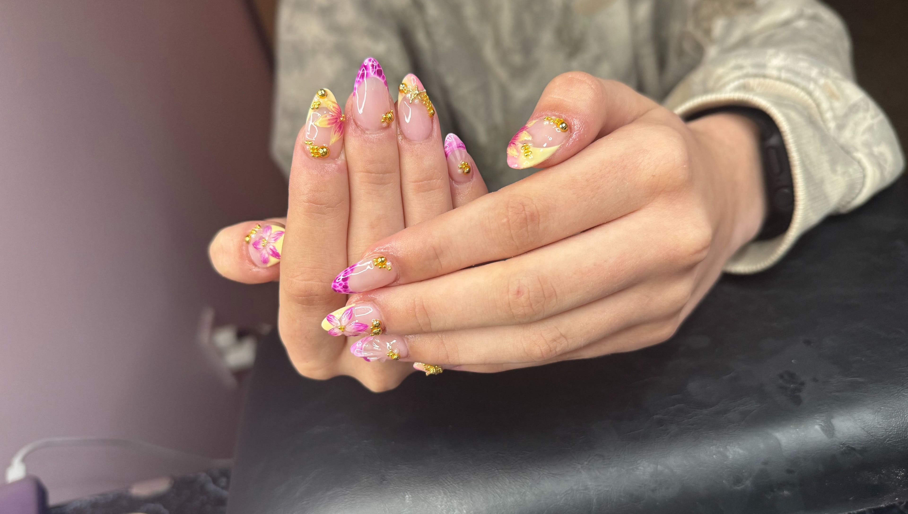 Vibrant floral nail art at PolishedByPaigie, Lloydminster, Alberta, CA. Perfect blend of colors and design.