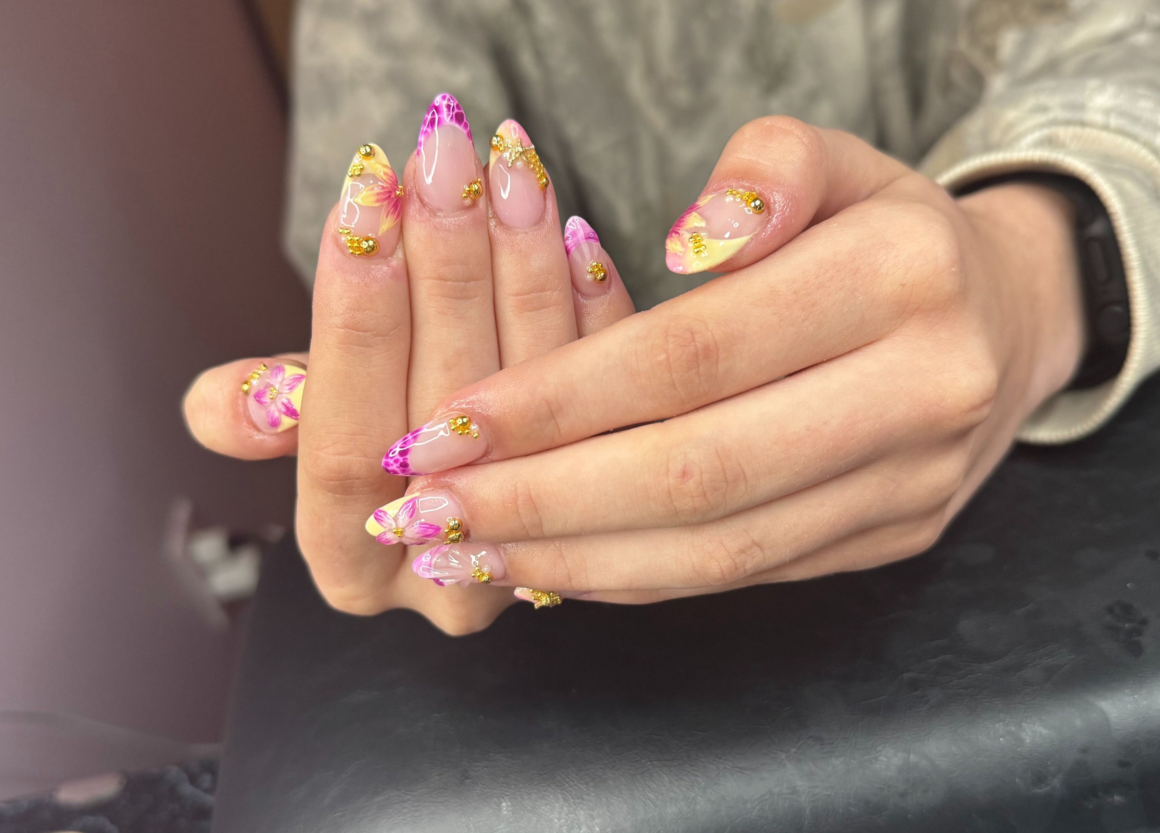 Vibrant floral nail art at PolishedByPaigie, Lloydminster, Alberta, CA. Perfect blend of colors and design.