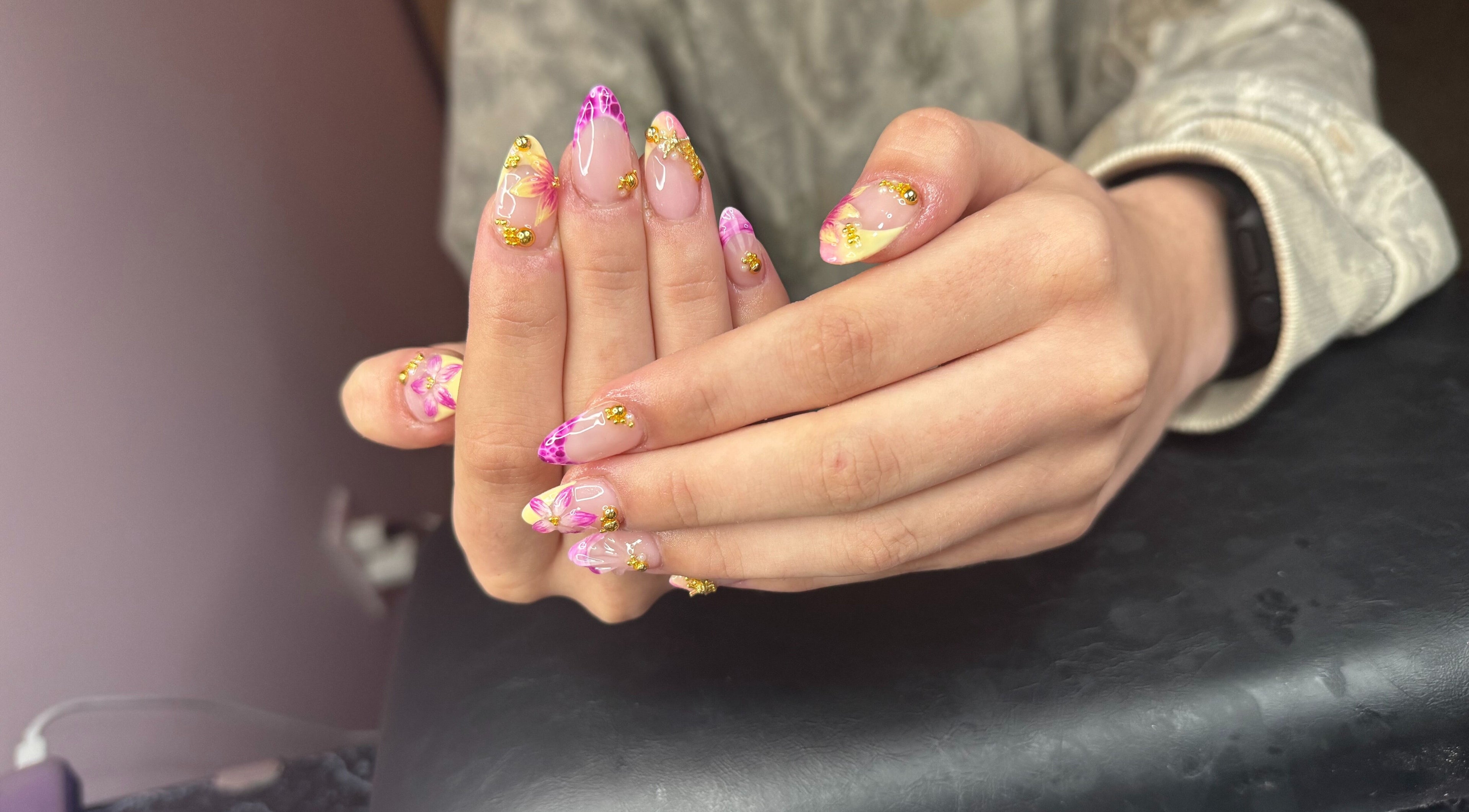 Vibrant floral nail art at PolishedByPaigie, Lloydminster, Alberta, CA. Perfect blend of colors and design.