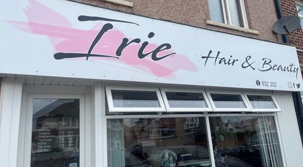 Front of Irie Hair and Beauty in Blackpool, England showcasing sign and opening hours.