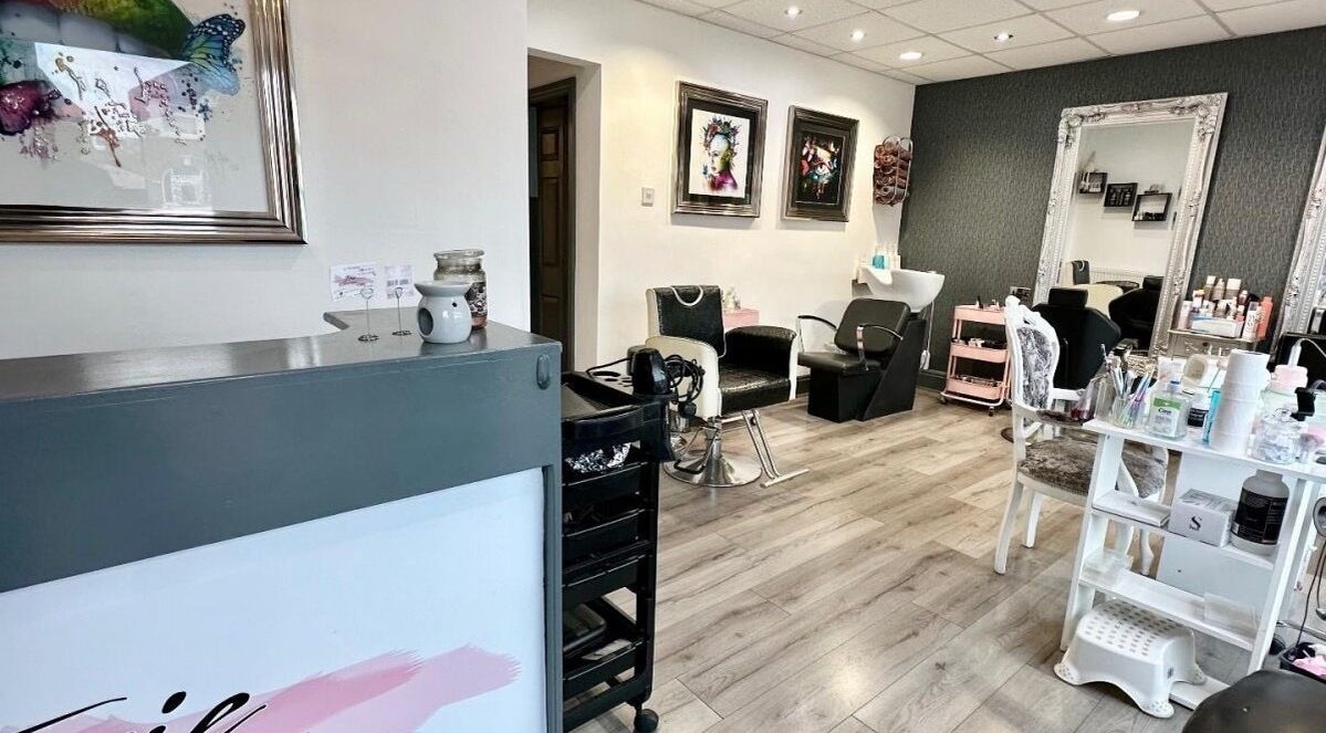 Elegant interior of Irie Hair and Beauty in Blackpool, England, GB showcasing styling stations and decor.