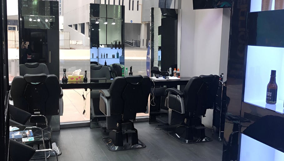 Elegant interior of Ace Barber Shop in Dubai, Dubai, AE, showcasing modern chairs and sleek mirrors.