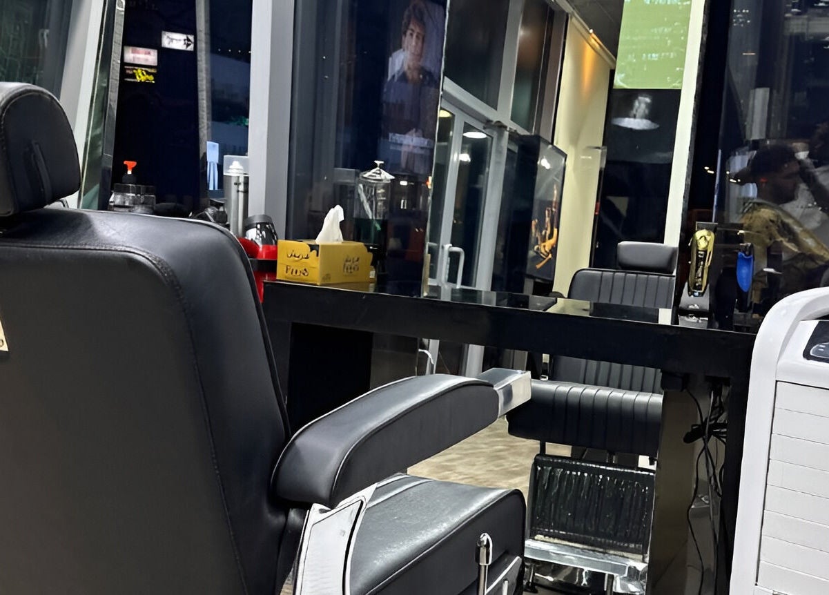 Sleek modern barber chair at Ace Barber Shop, Dubai, Dubai, AE, showcasing a luxurious grooming space.
