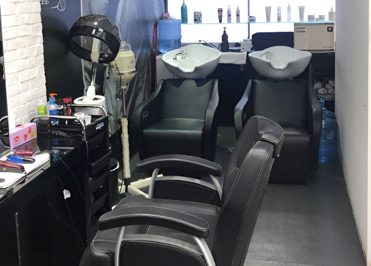 Modern interior of Ace Barber Shop in Dubai featuring sleek barber chairs and hair styling tools.