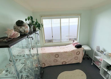 Serene treatment room at Lash Envy Boutique, Lake Haven, New South Wales, AU, featuring a cozy bed and calming decor.