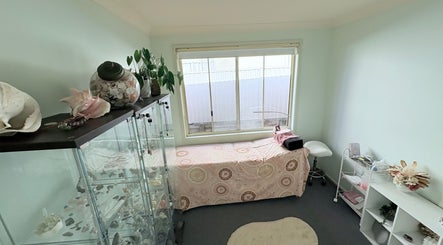 Serene treatment room at Lash Envy Boutique, Lake Haven, New South Wales, AU, featuring a cozy bed and calming decor.